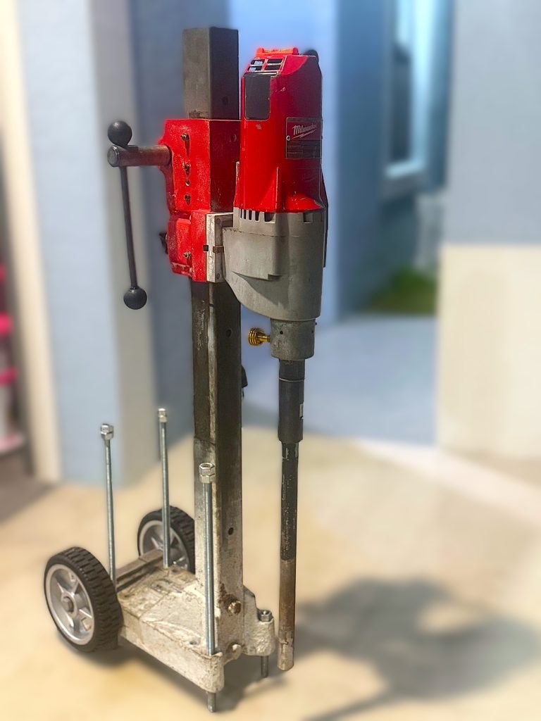 Milwaukee Diamond Core Drill Rig for safety pool fence drilling.